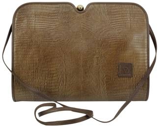 1788 - Anne Klein Lizard Embossed Leather Crossbody (Description): Anne Klein lizard embossed leather crossbody  purse featuring the signature lion logo.  Measures 8 inches wide by 11 inches tall by 2  inches deep.