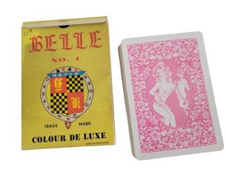 455 - Belle No. 1 King Sized Risque Playing Cards (Description): Vintage Belle No. 1 king sized nude lady  playing cards in original yellow box. The  deck features a Colour De Luxe design and was  made in Hong Kong. The cards have a pink  decorative back design featuring an ornate floral border with a reclining figure in the  center medallion.