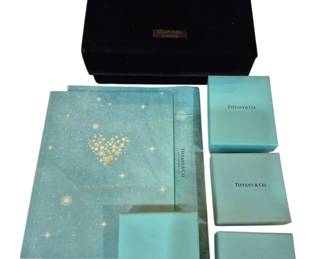 2712 - Group Chanel & Tiffany Boxes & Catalog (Description): A group of Chanel and Tiffany & Co. boxes and  catalog. The lot includes various Tiffany &  Co. branded boxes and packaging materials in  the signature robin's egg blue, along with a  Chanel box and Tiffany catalog.