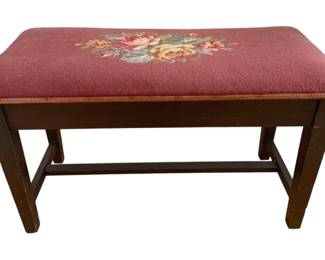 1358 - Antique Piano Bench 18"x30"x14.5" (Description): Antique piano bench featuring a needlepoint  upholstered seat with floral design on a  mauve background. The bench has a dark wood  frame with stretcher base construction.