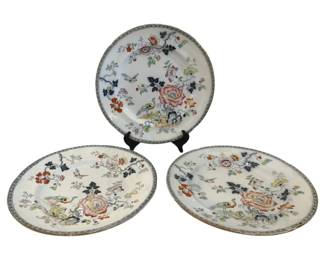 329 - 3 Oriental Floral Plates w/ Bird Motif 10" (Description): Set of three Oriental-style plates featuring  hand-painted floral and bird motifs. Each  plate displays a decorative design with  roses, branches, and perched birds in  polychrome colors including pink, orange, blue, and green against a white ground. The  plates feature a delicate patterned border.  Each plate measures 10 inches in diameter.