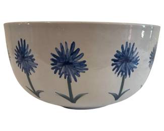 550 - Louisville Stoneware Large Bowl 14"x17.5" (Description): Louisville Stoneware bowl featuring a  hand-painted blue floral design on a  cream-colored ground. The bowl displays a  repeating pattern of blue cornflowers or  daisy-like blooms with green stems and leaves encircling the exterior. Measures 14" x  17.5"