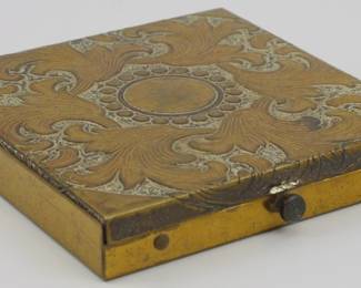 1747 - Vintage Brass Engraved Compact 3"x3" (Description): Vintage brass engraved compact featuring  ornate scrollwork and foliate designs on the  lid. Measures 3 inches by 3 inches.