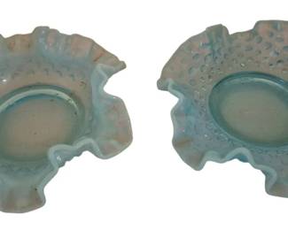 4183 - 2 Fenton Blue Opalescent Hobnail Bowls 6" (Description): Two Fenton blue opalescent glass bowls  featuring the classic hobnail pattern with  ruffled crimped edges. The bowls display a  delicate blue coloring with characteristic  opalescent white edges typical of Fenton's quality art glass production. Each bowl  measures 6 inches in diameter.