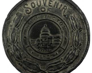 107 - 1923 Souvenir Lucky Nickel Coin 3" (Description): A 1923 souvenir lucky nickel coin featuring  the Washington D.C. Capitol building in  relief. The coin displays "Souvenir of  Washington Capitol D.C." text with decorative  laurel wreath border. Measures 3 inches in diameter.