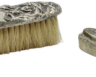 180 - 2 Vintage Sterling Silver Brush & Buffer 2.11oz (Description): Two vintage sterling silver brushes featuring  ornate repousse designs on the backs. The  set includes a clothes brush with natural  bristles and an ink blotter with a decorative  scrolled handle. Total weight 2.11oz.
