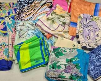 2854 - Lot of Assorted Designer & Vintage Scarves (Description): A colorful collection of assorted scarves  featuring various prints and patterns. The  lot includes designer pieces, notably a  signed Vera scarf with green and blue  geometric design. The collection showcases a range of styles including bold floral prints,  abstract swirl patterns, tropical motifs,  and classic William Morris-style botanical  designs. Colors range from vibrant blues,  pinks, and oranges to softer pastels and