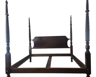 2041 - King Size Four Poster Bed by Howerton (Description): King size four poster bed by Howerton  featuring elegant turned and spiral carved  posts with decorative finials. The bed  showcases a traditional style with a shaped  headboard and sturdy wood construction in a rich dark finish. The frame includes side  rails and center support slats. Measures 86  inches long by 82.5 inches wide by 88 inches  tall.