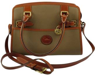 1782 - Dooney & Bourke All Weather Leather Bag (Description): Dooney & Bourke All Weather Leather bag  featuring the signature pebbled leather with  British tan trim and gold-tone hardware.  Measures 9 inches by 11 inches by 4 inches.