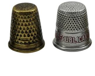 127 - 6 Vintage Thimbles, 1 Marked Sterling (Description): A collection of six vintage thimbles in  various styles and materials. One thimble is  marked sterling. The assortment includes  decorative examples with different textures  and patterns.