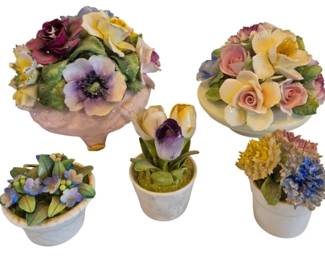 1470 - 5 Porcelain Floral Groups 4" (Description): Featuring delicate hand-painted blooms in  various arrangements. The pieces include  bouquets with roses, anemones, tulips, and  hydrangeas set in decorative bases and small  pots. Largest measures approximately 4".
