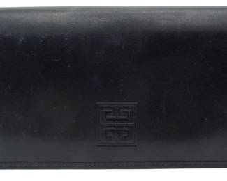 1807 - Givenchy Genuine Leather Long Wallet 3"x7.5" (Description): Givenchy genuine leather long wallet  featuring the iconic 4G logo. Measures 3  inches by 7.5 inches.