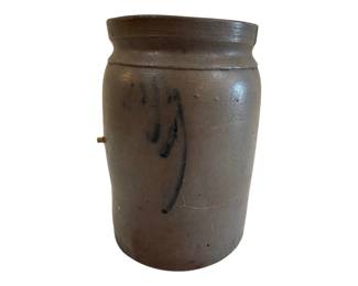 573 - Antique Salt Glazed Stoneware Crock 1 Gal (Description): Antique salt glazed stoneware crock with a  one gallon capacity. This utilitarian piece  features a rolled rim and cobalt blue  brushwork decoration on the front. The crock  exhibits the characteristic gray-brown coloring typical of traditional American  stoneware. Measures 10 inches tall by 6  inches in diameter.