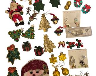 1984 - Group of Vintage Christmas Jewelry (Description): A delightful group of vintage  Christmas-themed costume jewelry featuring an  assortment of brooches, earrings, and pins.  The collection includes various holiday  motifs such as Santa Claus figures, Christmas trees, wreaths, holly leaves, reindeer, and  gift boxes. Pieces feature a mix of gold-tone  and enamel finishes, with some incorporating  colorful rhinestones and beadwork. Notable  items include a beaded Santa, Kim Rogers