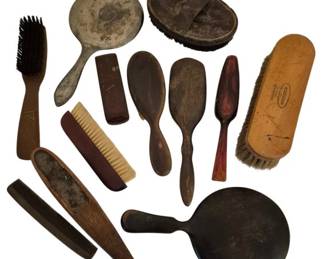 3939 - Assortment of Vintage Brushes, Mirrors & Etc (Description): A collection of vintage grooming accessories  including assorted brushes, hand mirrors, and  combs. The group features various styles and  materials including wood, ebony, and natural  bristle brushes. Items include clothes brushes, hair brushes, hand mirrors with aged  patina, and combs in different sizes. The  pieces display characteristic wear consistent  with age and use.