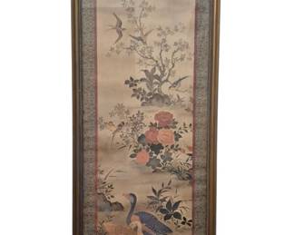 3736 - Chinese Silk Painting Birds & Flowers Framed (Description): Chinese silk painting depicting a traditional  scene with geese, swallows, and songbirds  among flowering branches and peonies. The  vertical composition features soft muted  tones with coral and blue accents. Mounted with silk brocade border in blue and  burgundy, presented in a gilt wood frame with  decorative finial at top. Measures 37.5" x  15".