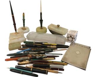 337 - Lot of Desk Items and Vintage Pens (Description): A collection of vintage desk items and pens.  The lot includes an assortment of fountain  pens, ballpoint pens, and mechanical pencils  in various colors and styles, along with desk  accessories including pen holders with marble or onyx bases, a glass pen tray, and a  metal notepad holder.