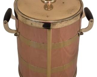 3951 - Vtg Copper & Brass Ice Bucket w/ Wood Handles (Description): Vintage ice bucket featuring a copper body  with decorative brass banding and vertical  straps. The piece includes a brass lid with a  ball finial and side-mounted handles with  dark wood grips. The barrel-style design suggests mid-century barware craftsmanship.  Measures 13" x 11".