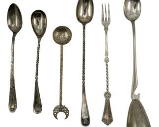 750 - Assorted Unmarked Silver Plate Utensils (Description): A collection of assorted unmarked and silver  plated utensils including various spoons, a  fork, and serving pieces. The pieces feature  decorative twisted handles and ornamental  designs.