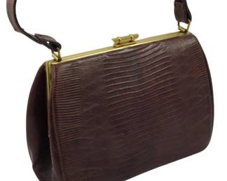 1792 - Vintage Genuine Lizard Skin Handbag 6"x8"x3" (Description): Vintage genuine lizard skin handbag featuring  a gold-tone metal frame and clasp closure  with a matching lizard skin handle. Includes  a matching mirror. Measures 6 inches by 8  inches by 3 inches.