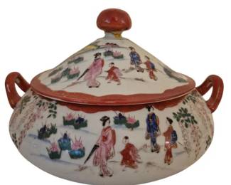 3997 - Satsuma Tureen w/ Lid 7"x11" (Description): Satsuma tureen with matching lid featuring  hand-painted figural scenes depicting  Japanese figures in traditional dress amid  garden landscapes with flowering trees. The  piece has a white ground with polychrome enamel decoration in pink, blue, red, and  green tones. Features twin handles and a  round knob finial on the conical lid, both  trimmed in rust-orange.