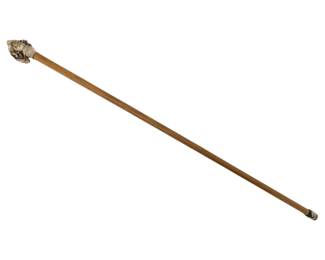 395 - Antique Cane w/ Carved Figural Handle 36" (Description): Antique walking cane featuring an ornately  carved figural handle depicting a bearded  man's head. The cane has a light wood shaft  with a metal ferrule at the tip. Measures 36  inches in length.