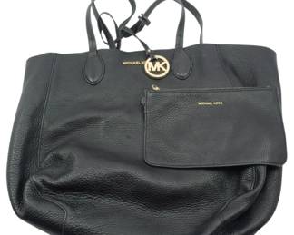 1849 - Michael Kors Tote Bag w/ Wallet 15"x18"x3" (Description): Michael Kors tote bag with matching wallet.  The tote features pebbled leather  construction with gold-tone hardware  including the signature MK logo charm. The  coordinating wallet is included. Measures 15 inches wide by 18 inches tall by 3 inches  deep.