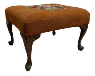 1409 - Needlepoint Stool 13"x16"x21.5" (Description): A needlepoint stool featuring a floral design  on the upholstered top. The stool is  supported by curved cabriole-style legs.