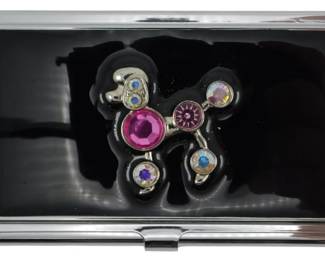 1946 - Vtg Rhinestone Poodle Business Card Holder (Description): Vintage decorative rhinestone poodle business  card holder featuring colorful rhinestone  accents on a black enamel poodle design.  Measures 2 inches by 3.5 inches.