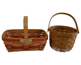 595 - 2 Longaberger Woven Baskets (Description): Two Longaberger handwoven baskets featuring  swing handles. One is a rectangular basket  with red accent weaving and a brass  Longaberger Gingerbread Basket plaque from  the Christmas Collection, measuring 7"x10"x7". The second is a round natural  woven basket measuring 5"x7". The rectangular  basket has some damage noted.