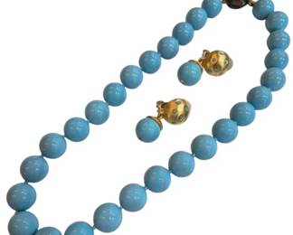 1979 - Vtg Turquoise Blue Bead Necklace & Earrings (Description): Vintage necklace and earrings set featuring  turquoise blue beads. The necklace is  composed of graduated round beads with a  decorative gold-tone clasp adorned with  matching blue cabochons. The coordinating clip-on earrings feature gold-tone settings  with blue cabochon accents.