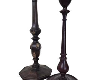 1286 - Pair of Turned Wood Candlesticks 18" Tallest (Description): A pair of turned wooden candlesticks in a  dark finish. One features an octagonal base  with decorative gilt leaf motifs on the  baluster stem, while the other has a circular  stepped base with a simpler turned profile. Both display classic Georgian-style turnings  with urn-form candle cups. The candlesticks  are mismatched but complementary in their  traditional design.