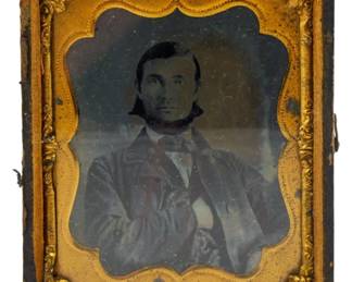 194 - Sixth Plate Daguerreotype 3.5"x3" (Description): A sixth plate daguerreotype featuring a  portrait of a gentleman. The image is housed  in its original case with an ornate gilt  brass mat. Measures 3 1/2 inches by 3 inches.