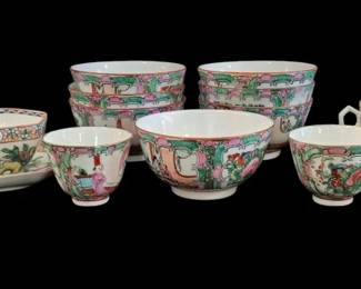 500 - Lot of Assorted Rose Medallion Cups & Bowls (Description): A lot of assorted Rose Medallion cups and  bowls featuring traditional Chinese export  porcelain decoration. The collection includes  teacups and various sized bowls, each  hand-painted with characteristic panels depicting figures, birds, butterflies, and  floral motifs in vibrant colors of pink,  green, and gold on a white ground.
