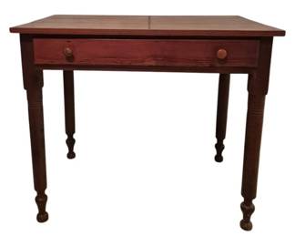 3738 - Knotty Pine Pegged Table w/ Drawer (Description): Knotty pine pegged table featuring a single  drawer with two wooden knob pulls. The table  rests on turned legs with ring detailing and  ball feet. The piece displays a warm  reddish-brown stain finish characteristic of country or farmhouse style furniture.  Measures 28.5 inches tall by 34 inches wide  by 31 inches deep.