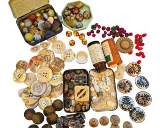 1460 - Asst Vtg Mother of Pearl Buttons & More (Description): Assorted vintage mother of pearl buttons in  various sizes, along with an eclectic  collection of additional button types  including carved wooden buttons, decorative  glass buttons, cloisonne-style buttons, red glass beads, and ornate metal buttons. The  collection is housed in several vintage tins  and containers including what appears to be  an old medicine bottle and small metal boxes.  A wonderful assortment for collectors,