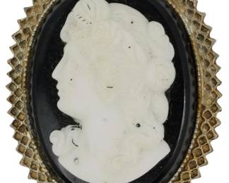 1904 - Cameo Scarf Clip/Brooch (Description): A cameo scarf clip and brooch featuring a  classical profile portrait. The piece can be  worn as either a scarf clip or a brooch.