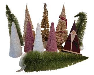 4179 - Group Lot of Decorative Christmas Trees (Description): Group lot of decorative Christmas trees  featuring an assortment of bottle brush style  trees in various colors including green,  white, pink, cream, and gold glitter. The  collection includes trees of varying heights and styles, along with a wooden triangular  Santa Claus figure and green tinsel garland.