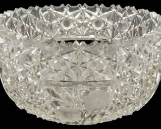 142 - Cut Glass Bowl 4"x8" (Description): Cut glass bowl featuring intricate geometric  patterns. Measures 4 inches tall by 8 inches  in diameter.