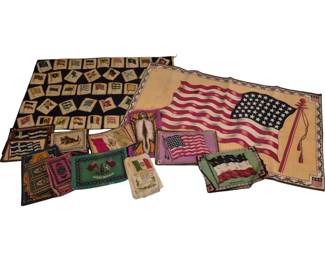 4044 - Group Lot of Vtg Flag Textiles & Felts (Description): Group lot of vintage flag-themed textiles and  felts. The collection includes a large  American flag pillow cover or wall hanging on  tan fabric, a navy blue textile featuring  multiple international flag designs arranged in a grid pattern, and various smaller  flag-themed felt pieces depicting flags from  different nations including the United  States, Great Britain, Mexico, and others.  The pieces appear to be from the early to