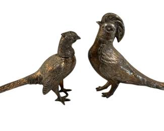 368 - S&P Buffet Birds 7"x5" (Description): A pair of decorative salt and pepper buffet  birds, featuring detailed metallic finish  with intricate feather texturing. These  elegant pheasant-style figures make a  distinguished addition to any table setting. Measures 7" x 5".