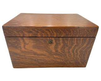 1210 - Vtg Quarter Sawn Oak Humidor Tobacco Box (Description): Vintage quarter sawn oak humidor tobacco box  featuring distinctive tiger oak grain  pattern. The hinged lid box has a small brass  keyhole escutcheon on the front. Measures 12  x 8 x 7