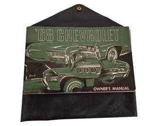 3804 - 1968 Chevrolet Owner's Manual w/ Cover (Description): 1968 Chevrolet owner's manual featuring a  green illustrated cover depicting various  Chevrolet models including the Impala and  Caprice. The manual is housed in its original  protective cover with snap closure. A collectible piece of automotive literature  for classic Chevrolet enthusiasts.