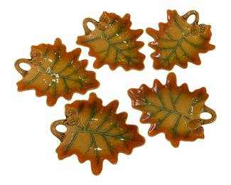 643 - 5 Ceramic Leaf Dishes w/ Acorn Handles 12x10 (Description): Each dish measures 12 inches by 10 inches.  The glazed pieces display autumn coloring  with detailed leaf vein patterns.