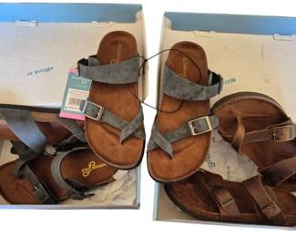 2829 - 3 Mountain Sole Sandals in Boxes Size 6 (Description): Three pairs of Mountain Sole sandals in their  original boxes, all size 6. The collection  includes sandals in varying earth-tone  leather straps featuring brown and gray  colorways. Each pair features cork footbeds with buckle closures in a Birkenstock-style  design.