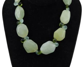 1897 - Tanner Stone Bead Necklace (Description): A Tanner stone bead necklace featuring  polished stone beads in varying sizes. The  necklace showcases natural stone elements  arranged in an elegant design.