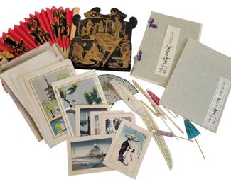 436 - Group of Oriental Items (Description): A diverse collection of Oriental items  including Japanese woodblock print  reproductions featuring landscapes and  traditional scenes, a decorative red and gold  paper fan, a black lacquered panel with gilded figural scenes, miniature paper  parasols, a carved bone or ivory fan, and two  cloth-covered books or albums with Japanese  calligraphy on their covers. The prints  depict various subjects including pagodas,