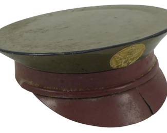 1749 - WWII Era Military Cap Compact 3" (Description): A WWII era military cap compact. This novelty  compact is designed in the shape of a  military service cap, complete with painted  details and insignia. Measures 3 inches.