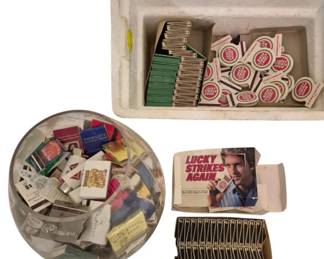 3921 - Collection Vintage Matchbooks (Description): A large lot of vintage matchbooks featuring a  variety of advertising and designs. The  collection includes numerous Lucky Strike  promotional matchbooks, along with assorted  matchbooks from various businesses, hotels, and establishments. The matchbooks display a  range of colors and graphics typical of  mid-20th century advertising collectibles.