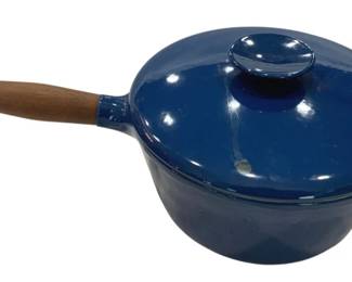 905 - Copco Denmark Blue Enamel Cast Iron Pot w/Lid (Description): Blue enamel cast iron pot with matching lid.  Features a wooden handle with metal end cap  and a small side handle for easy lifting. The  interior appears to be light-colored enamel.  Measures 15 inches by 9 inches by 2 inches.